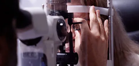 Patient undergoing eye exam for blurry vision after cataract surgery in Turkey, checking post-op clarity