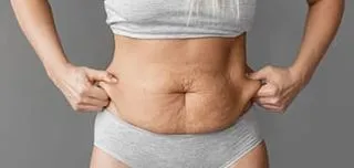 close-up-woman-holding-belly-fat