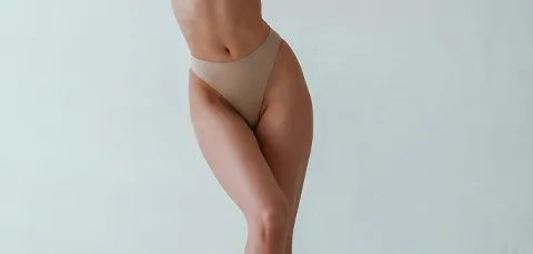 Woman with sculpted waist, hips, and thighs—showing results achievable after lower body-lift (belt lipectomy) surgery