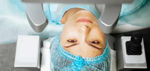 Patient lying down for a procedure involving accommodating intraocular lenses (IOLs) for cataract surgery