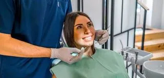 woman-having-teeth-examination-at-the-dentist